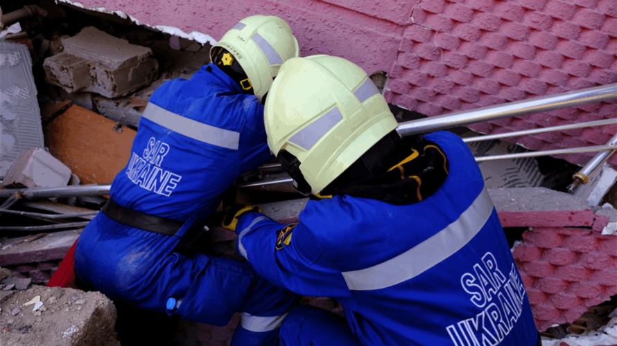 Ukrainian rescuers fly in from war zone to save lives in Turkey