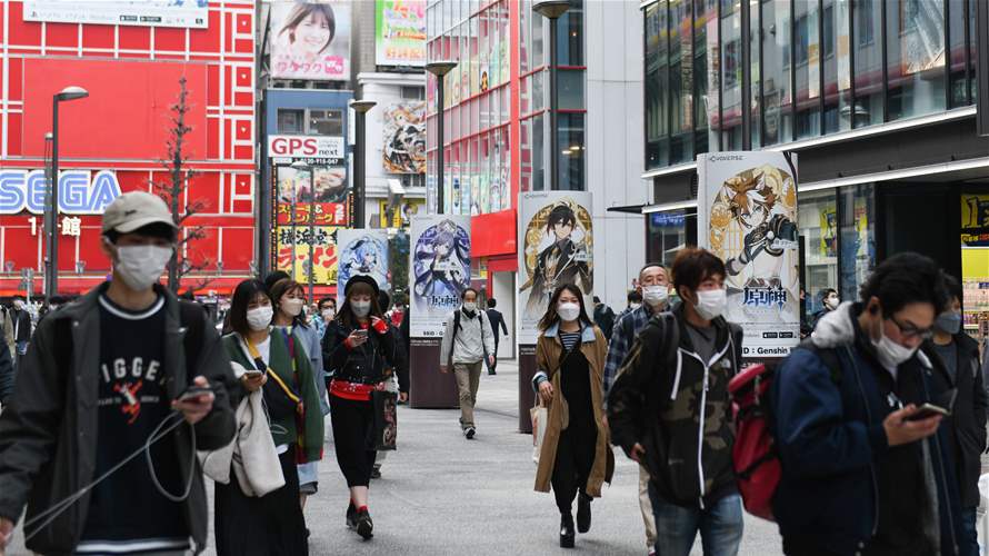 Japan says economy in modest recovery, caution over global slowdown