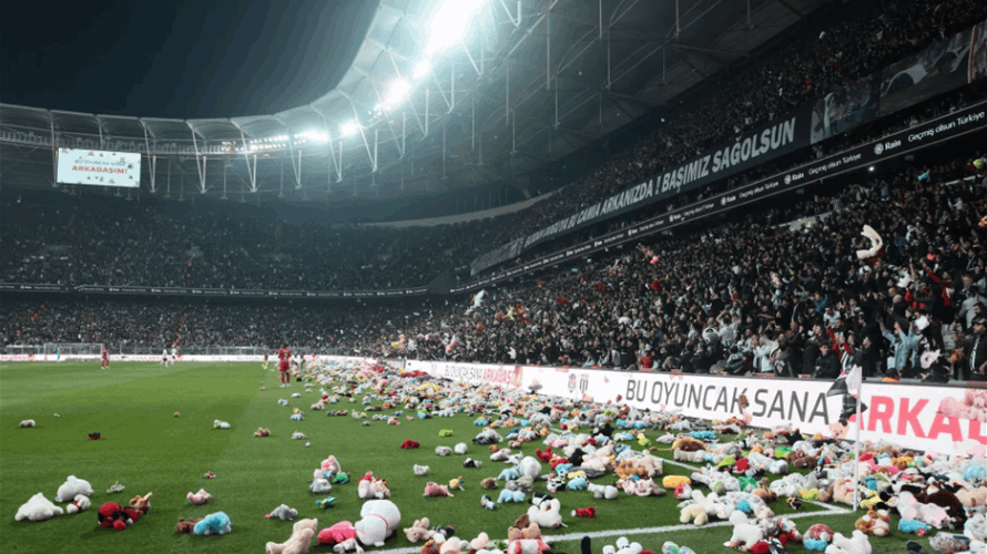 Besiktas fans throw toys on field for children affected by earthquake