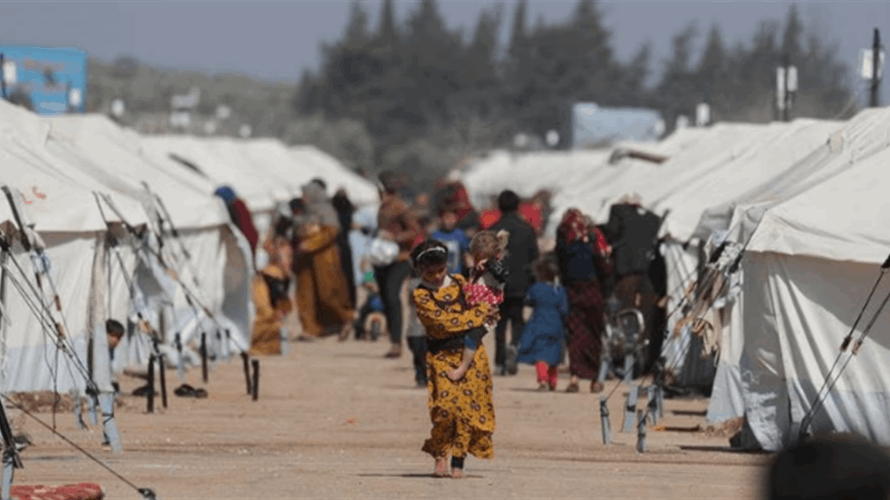 At graveyard of unknown quake victims, Syrians seek news of the missing