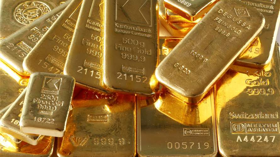 Gold gains on softer dollar as traders await US inflation data
