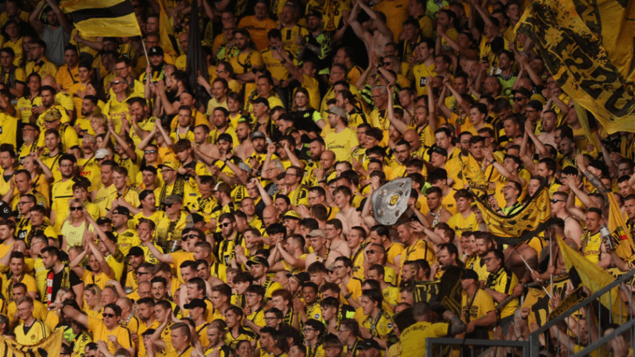 Dortmund keep lid on euphoria as Bundesliga title race goes to the wire