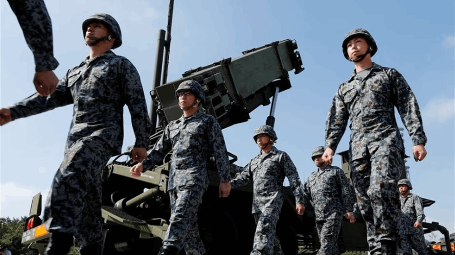 Japan puts missile defense on alert as N.Korea warns of satellite launch