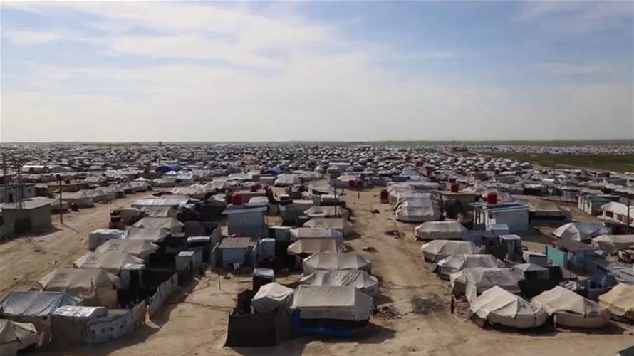 العراق يعيد 700 شخص من مخيم الهول في سوريا
