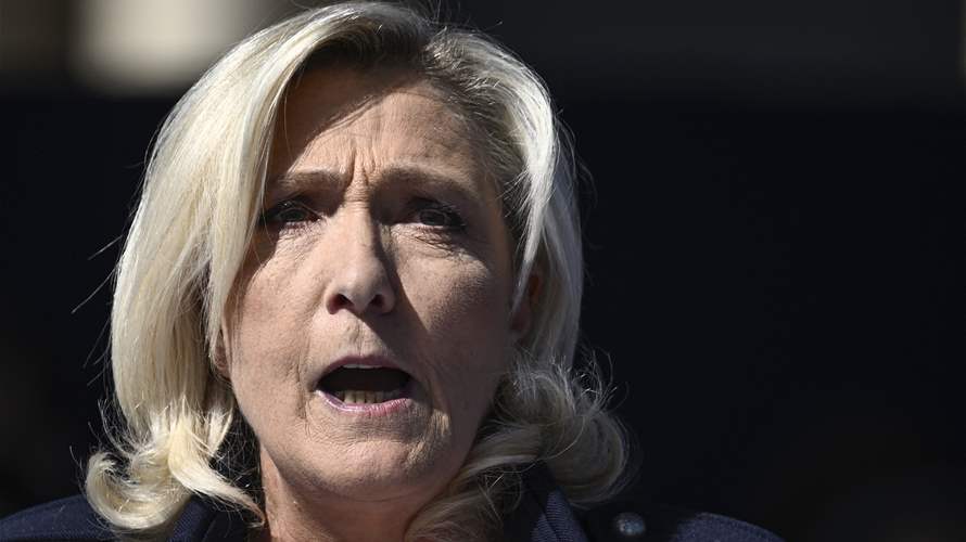 'I won't give up,' Le Pen tells Paris rally