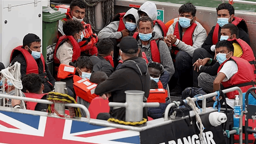 UK says first migrants held under return deal with France