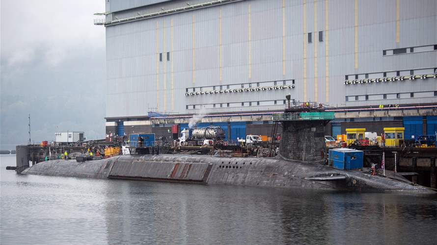 Iranian man, Romanian woman charged over attempt to enter UK submarine base