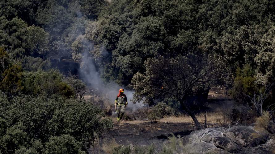 Wildfires force more than 200,000 in total to flee in France and Spain 