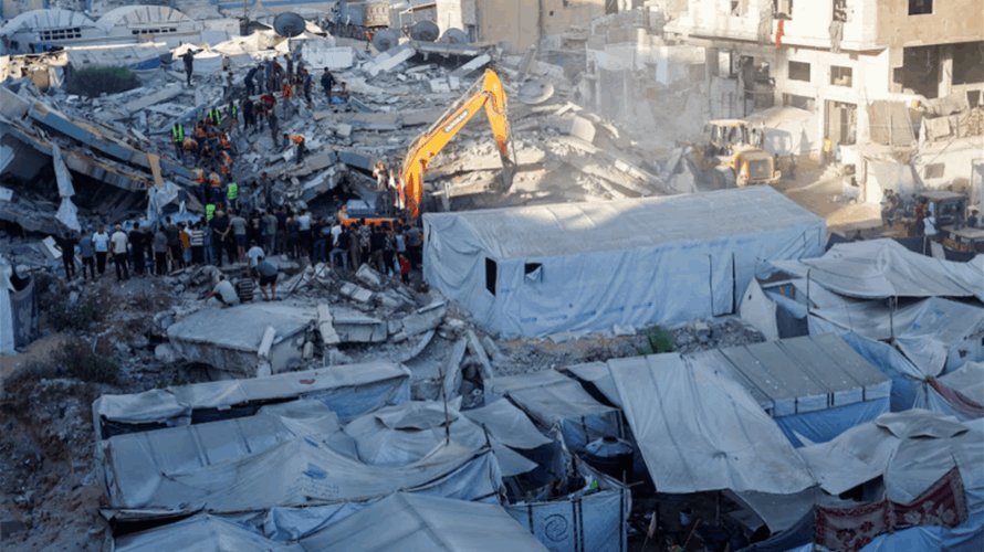 Gaza civil defense says toll from building collapse rises to 20, including five children