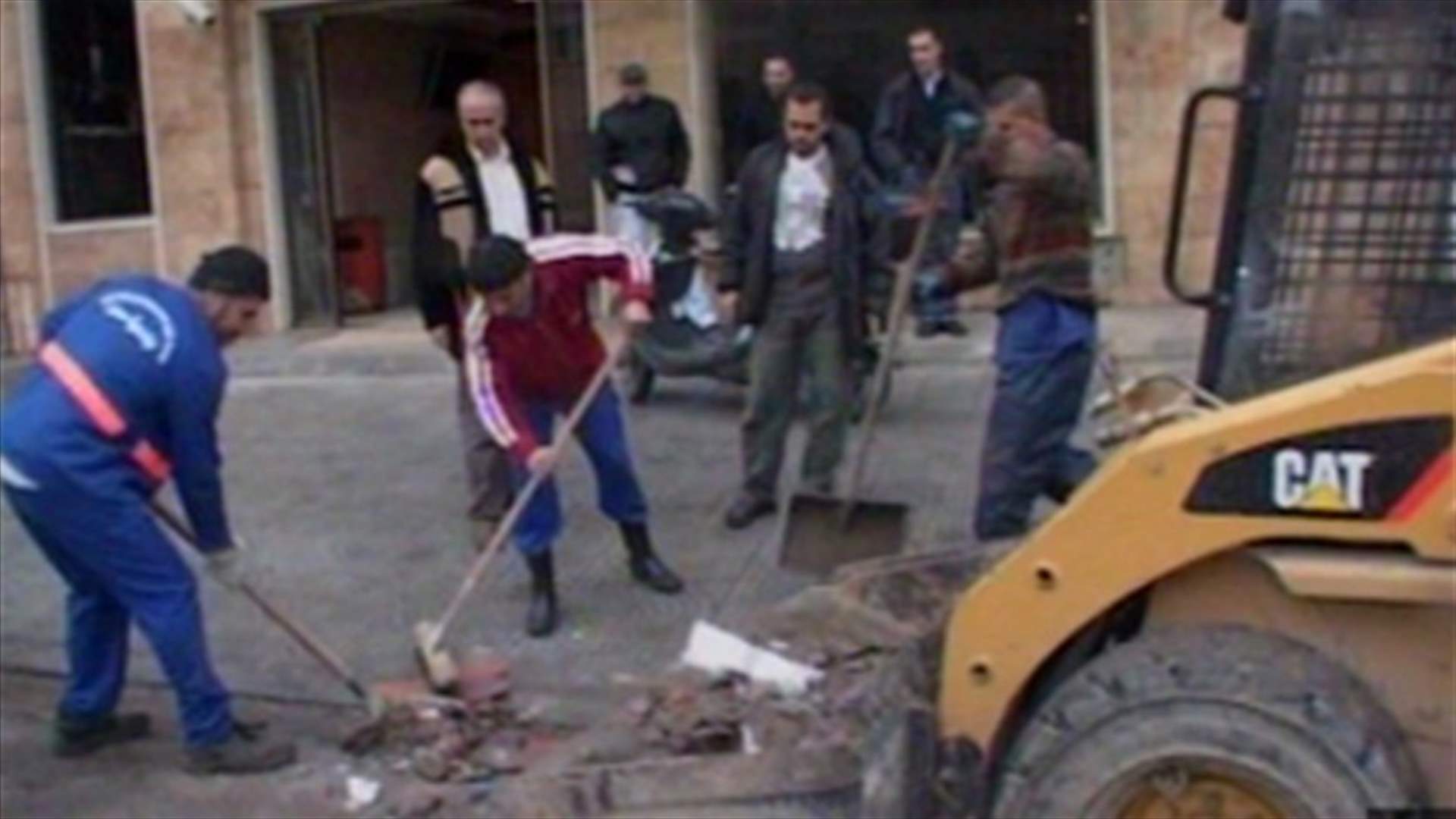 Tyre workers remove twin blasts rubble 