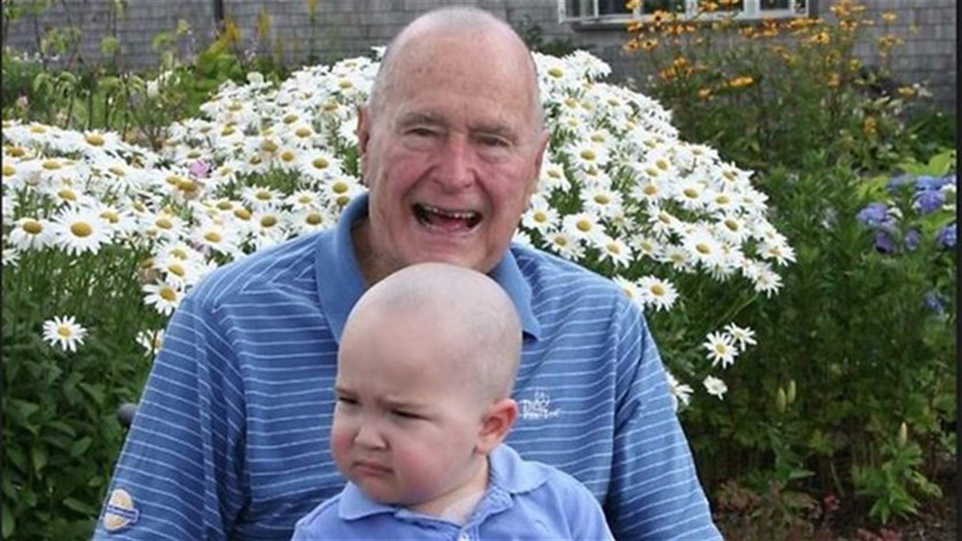 George H.W. Bush shaves head in support of boy with leukemia