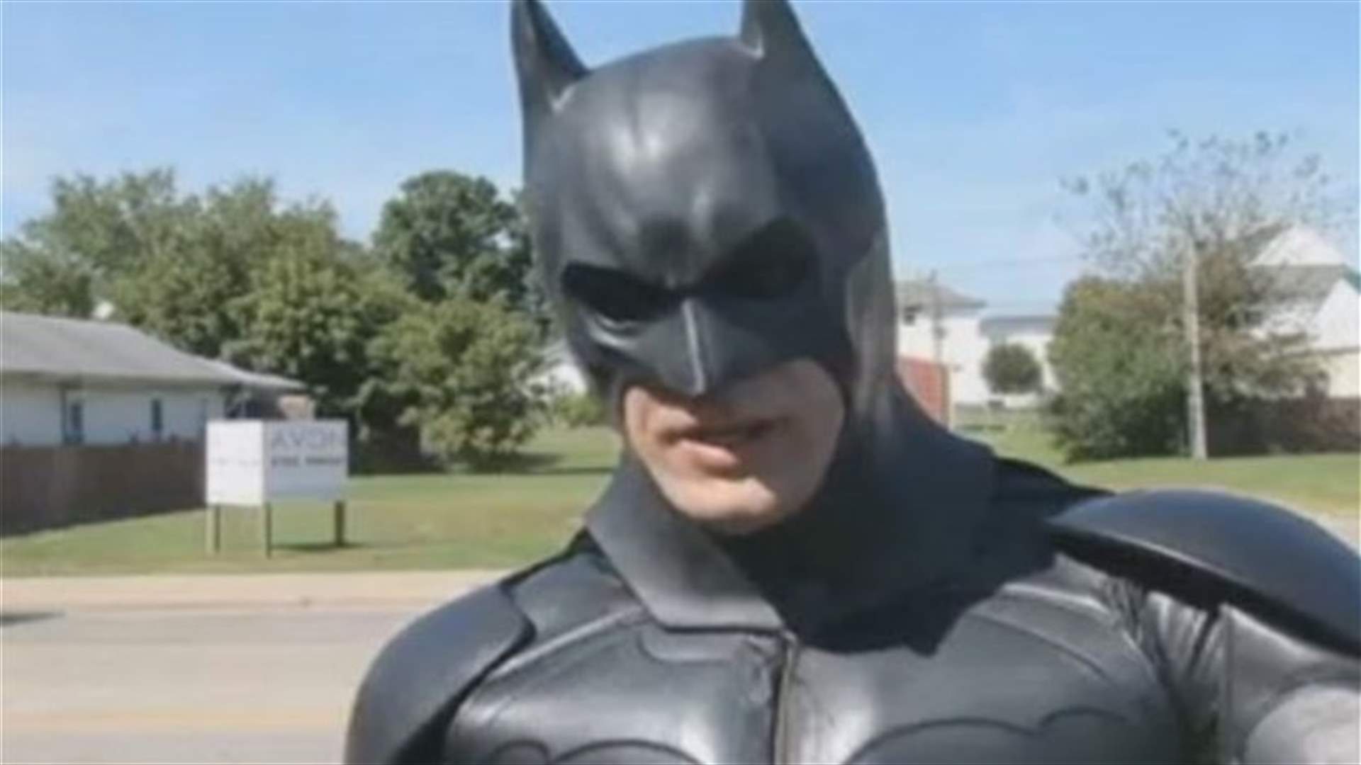 Men dressed as Batman, Capt. America rescue cat