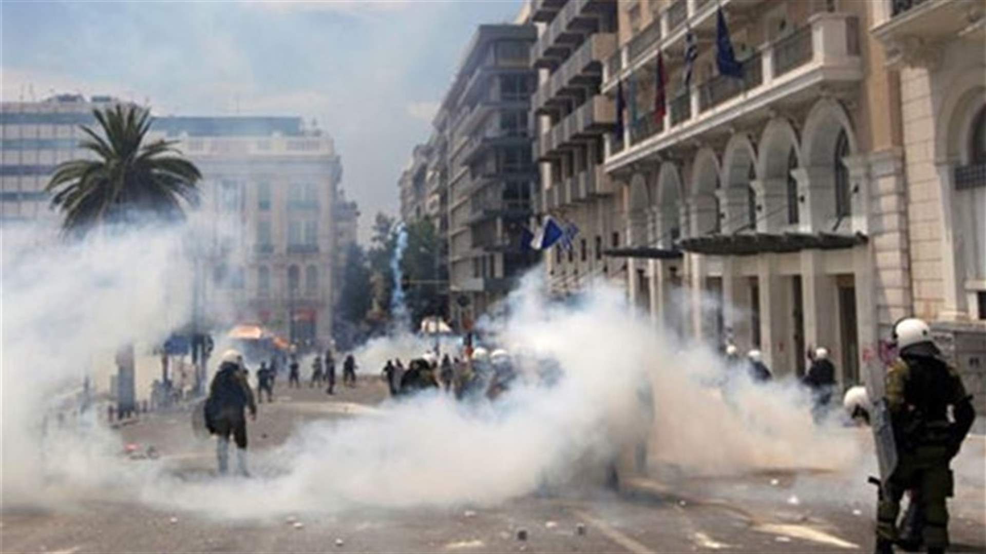 Greek riot police storm former state TV building, evict protesters