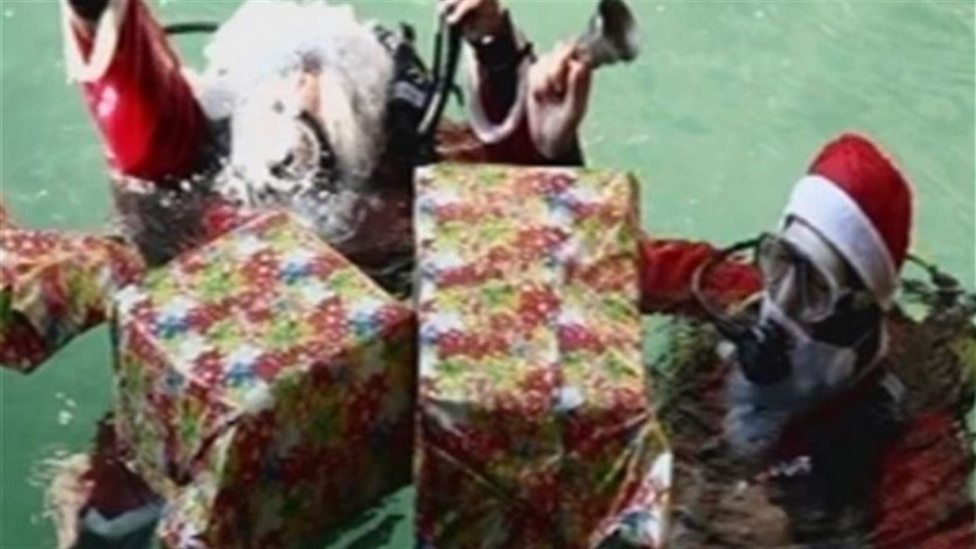REPORT: Civil Defense unit lights underwater Christmas tree