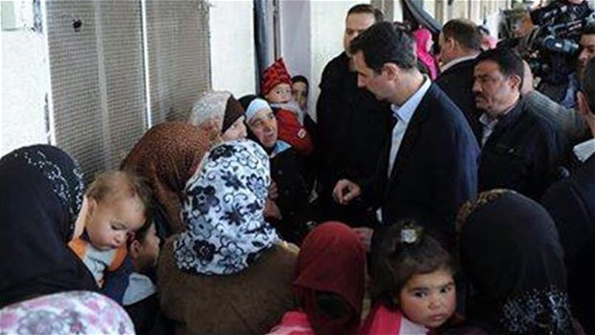 Assad visits displaced Syrians outside Damascus - TV