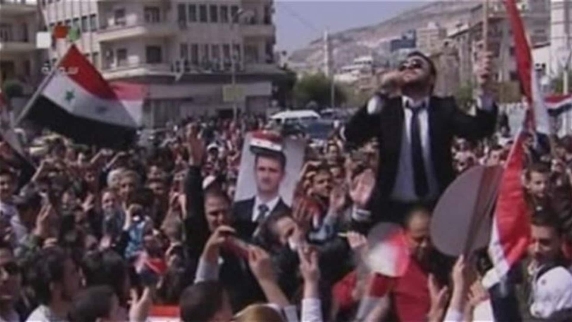 Syrian protesters hold pro-Assad demonstration in Damascus