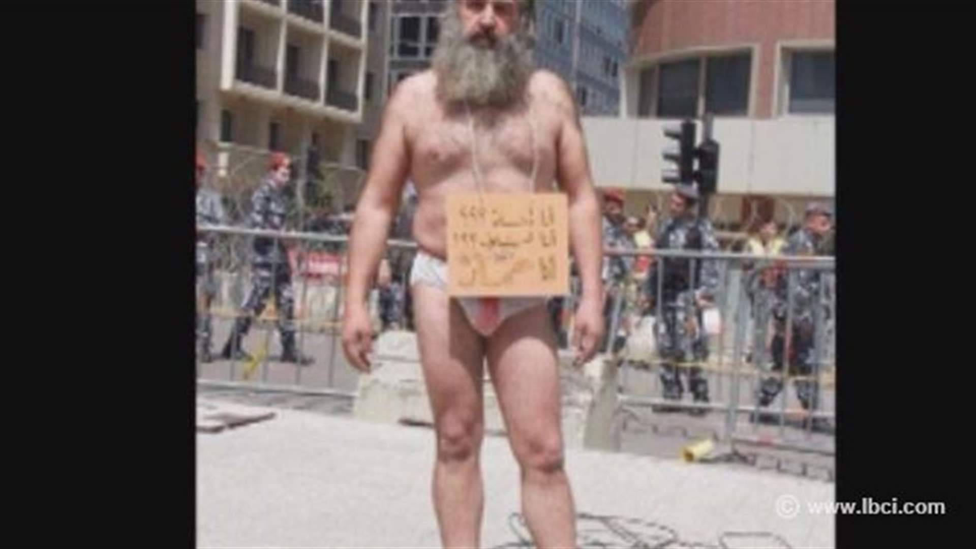 Semi-naked Lebanese protester reveals tragic story from his hospital bed