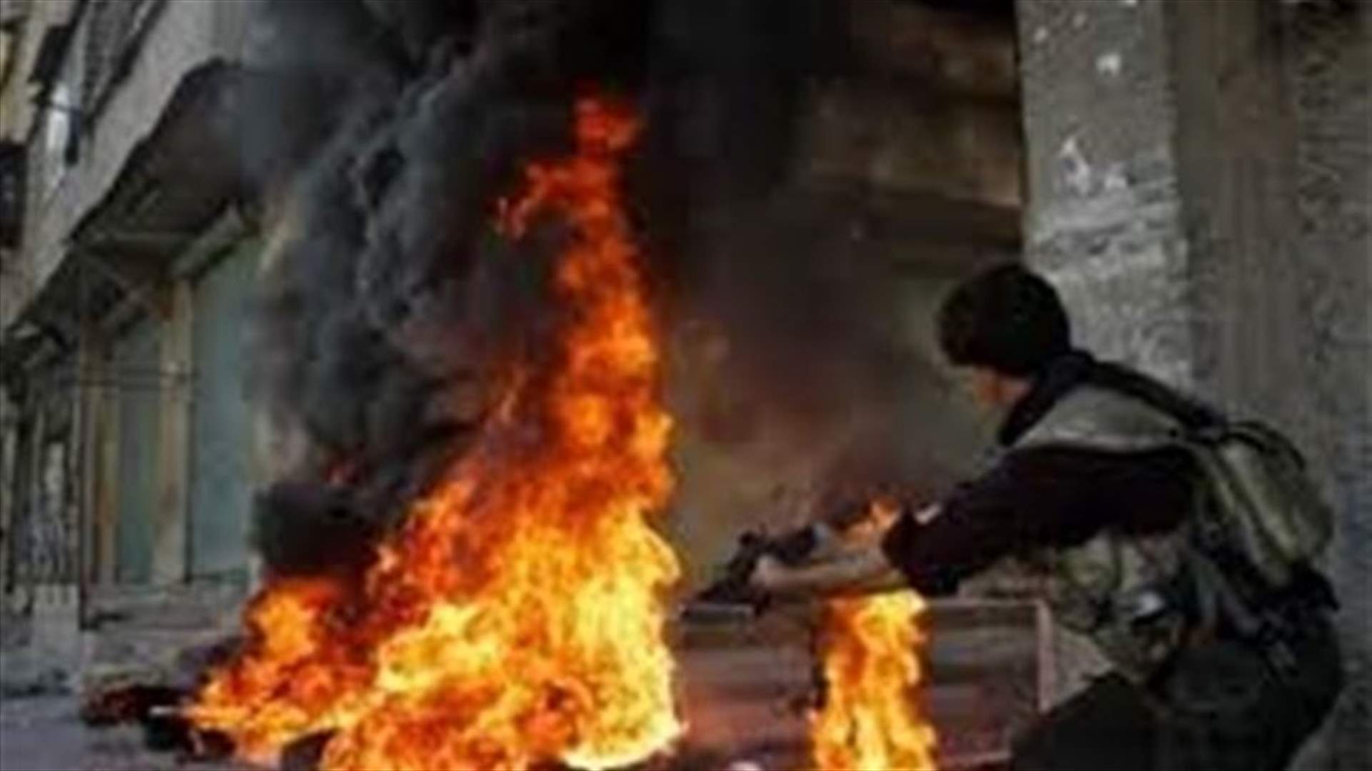At least 100 killed in twin car bombs in Homs