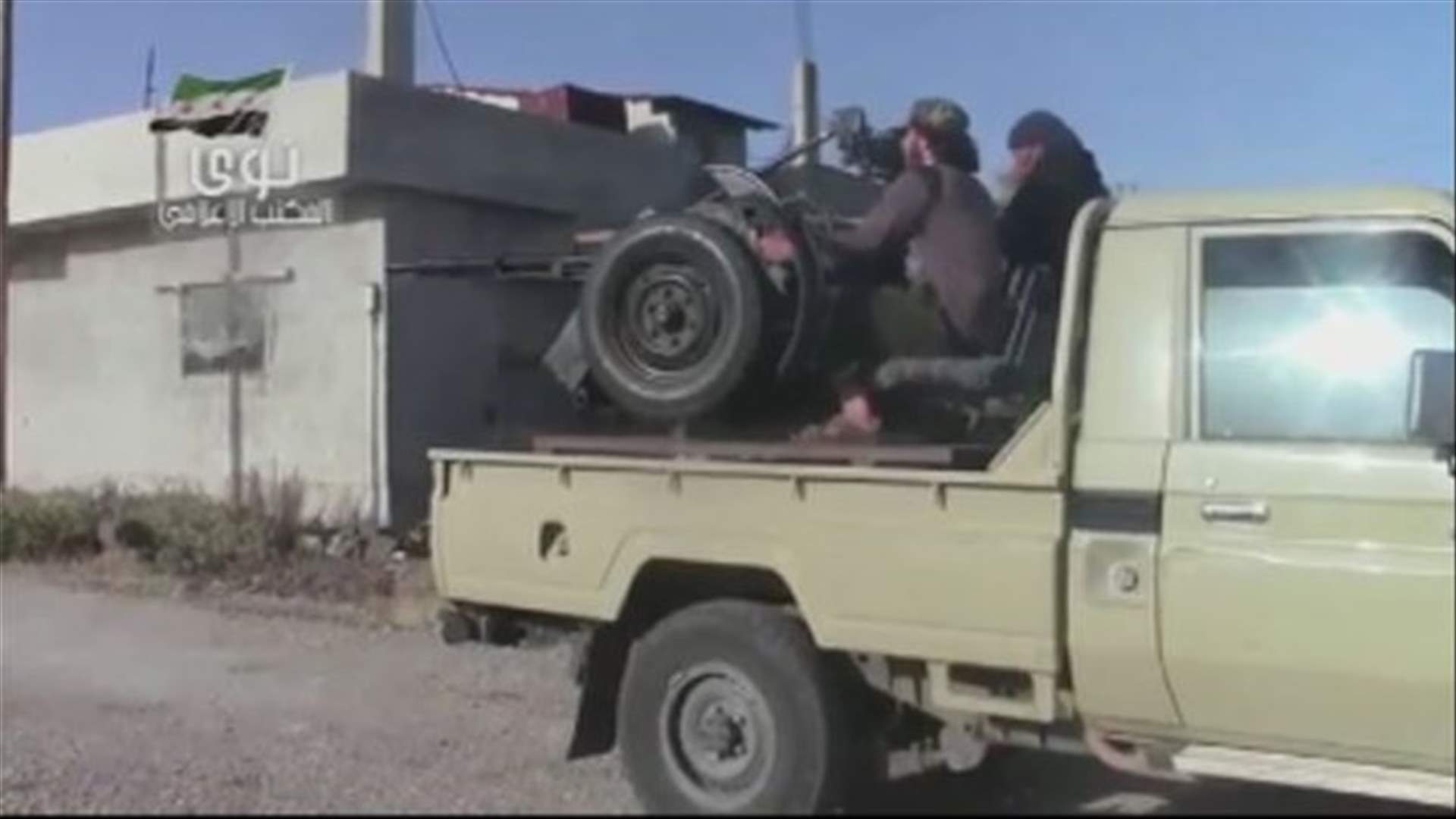 Syria air defense head killed, rebels take northern town
