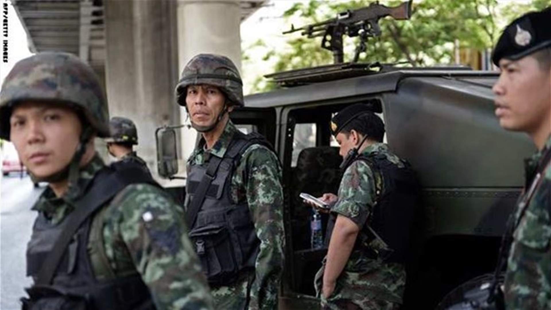 Opposition to Thai coup simmers, ex-PM in "safe place" 