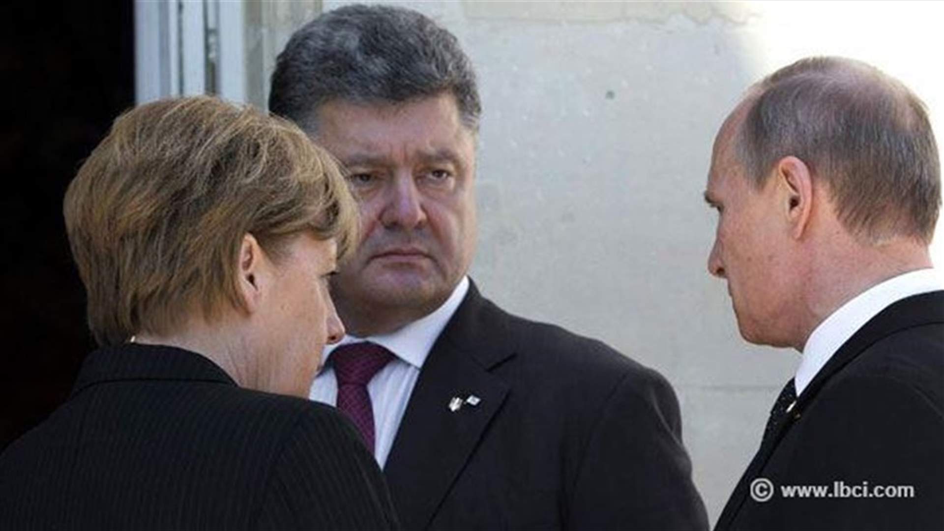 Russia, Ukraine leaders shake hands, talk at D-Day event