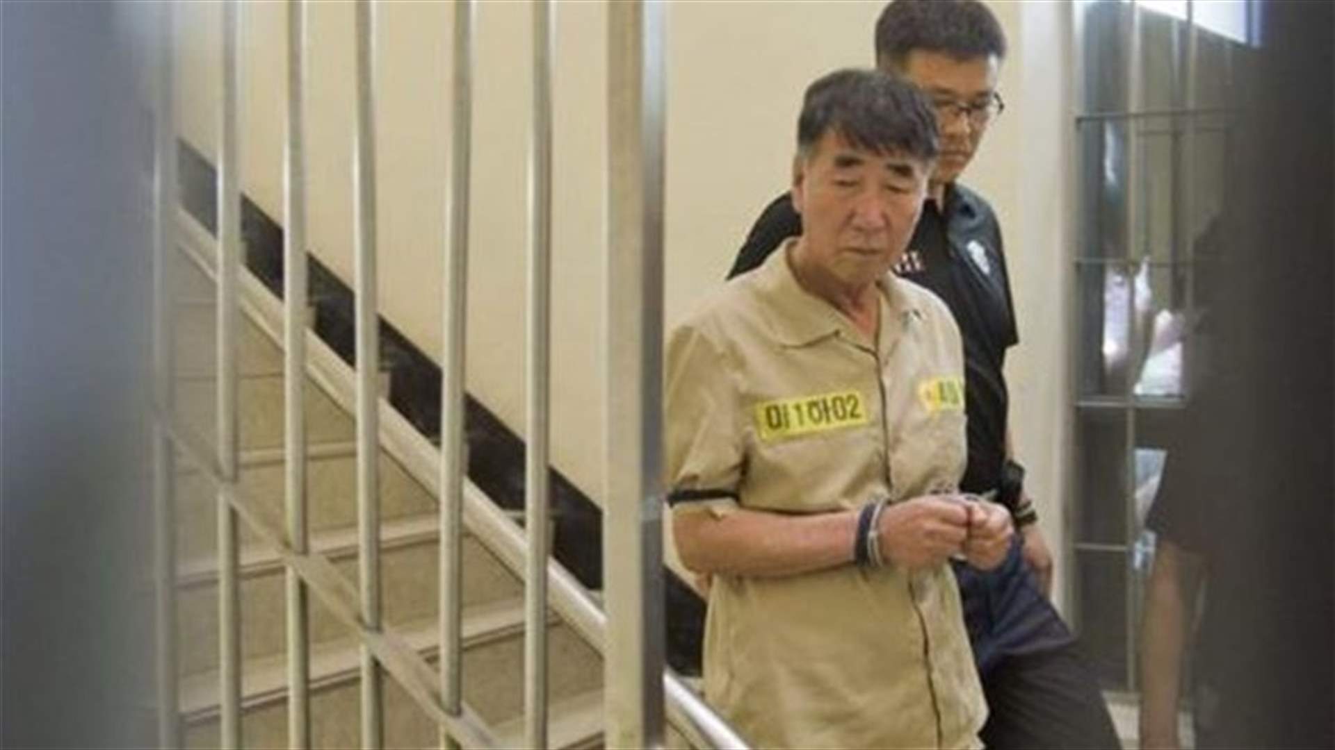 Shout of "murderer" goes up in packed court as Korea ferry crew face trial