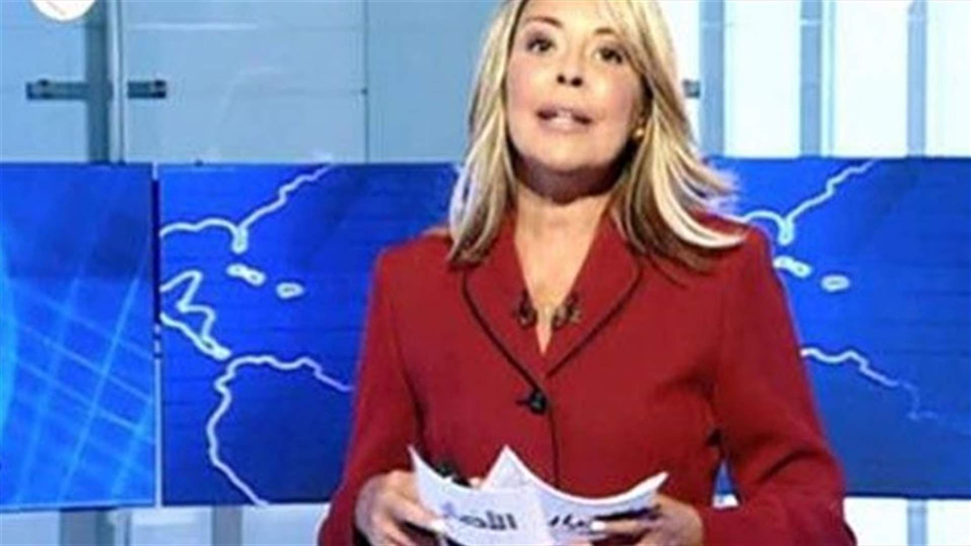 اعلامية عراقية مسلمة ترتدي الصليب على الهواء تضامناً مع مسيحيي الموصل