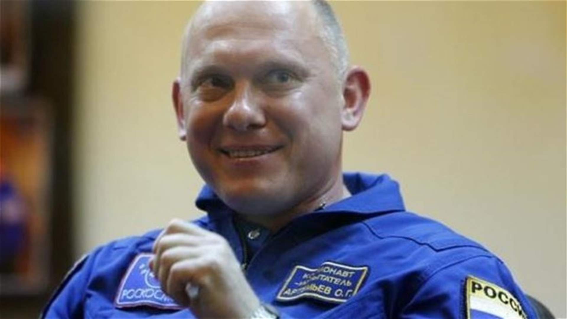 Spacewalking cosmonauts launch satellite, set up studies