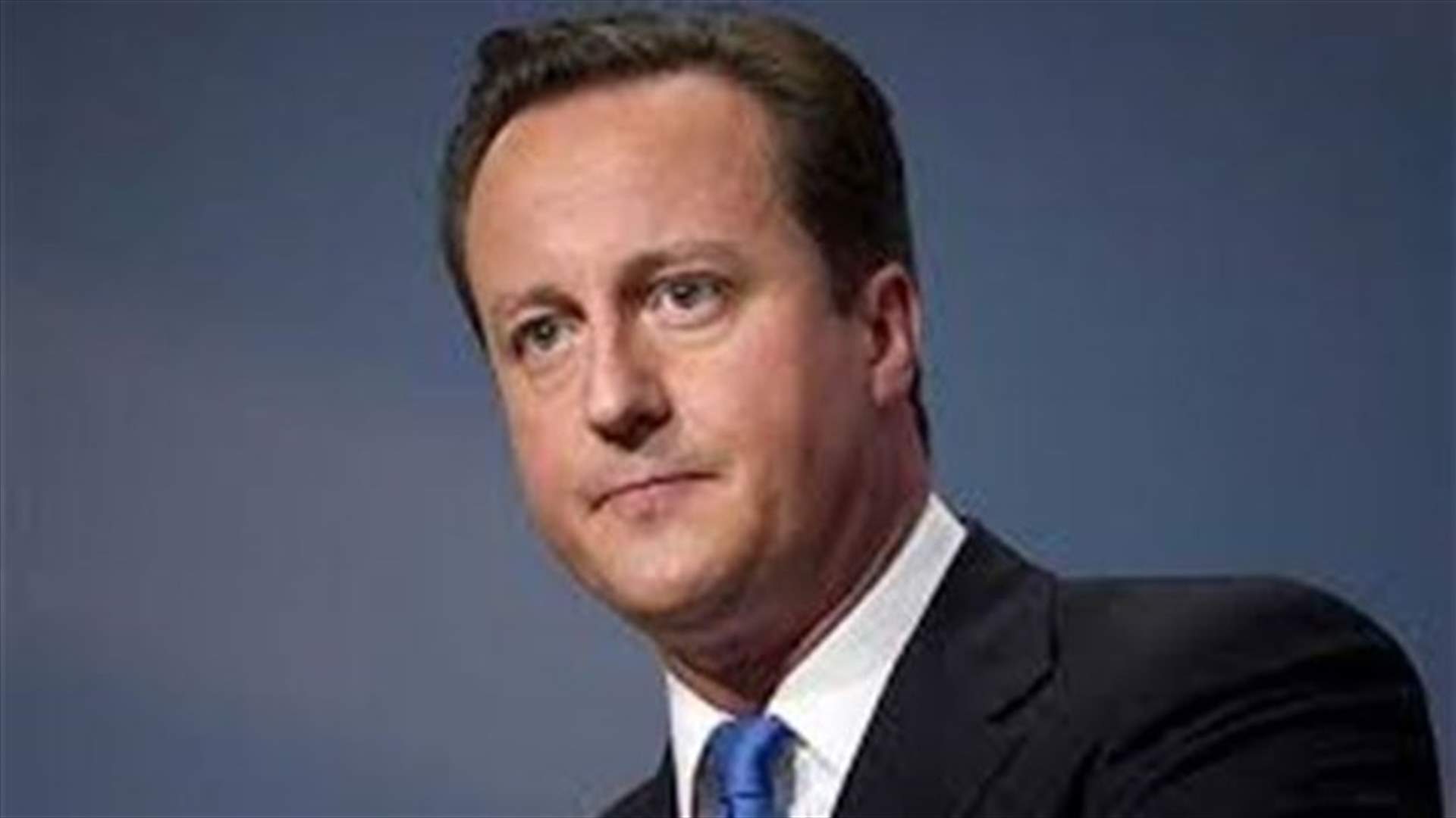 British PM 'kicking himself' after saying Queen purred at Scotland vote