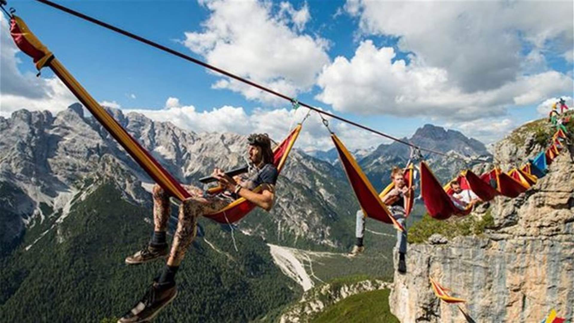 People Sleeping On Hammocks Hanging Hundreds Of Feet Above The Italian Alps!?