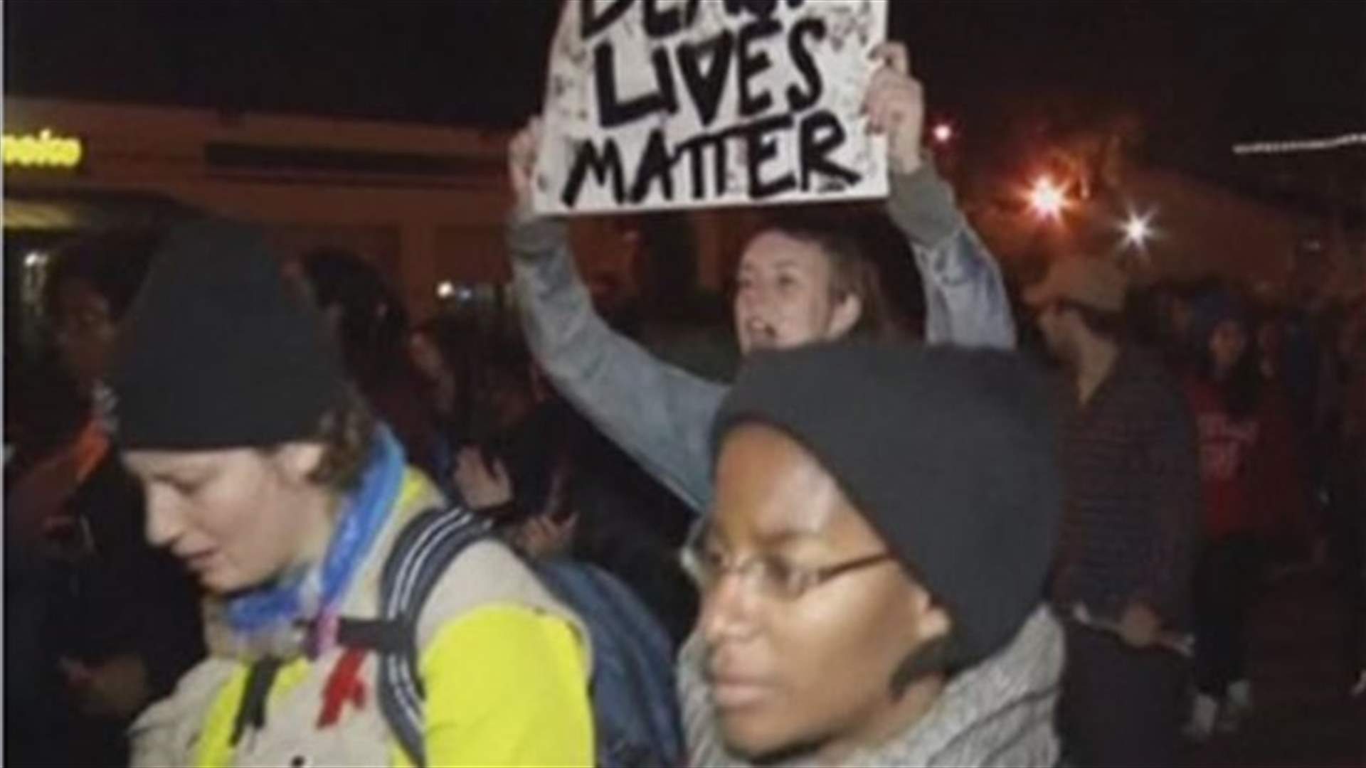 Marchers confront riot police over Missouri shootings, more protests planned