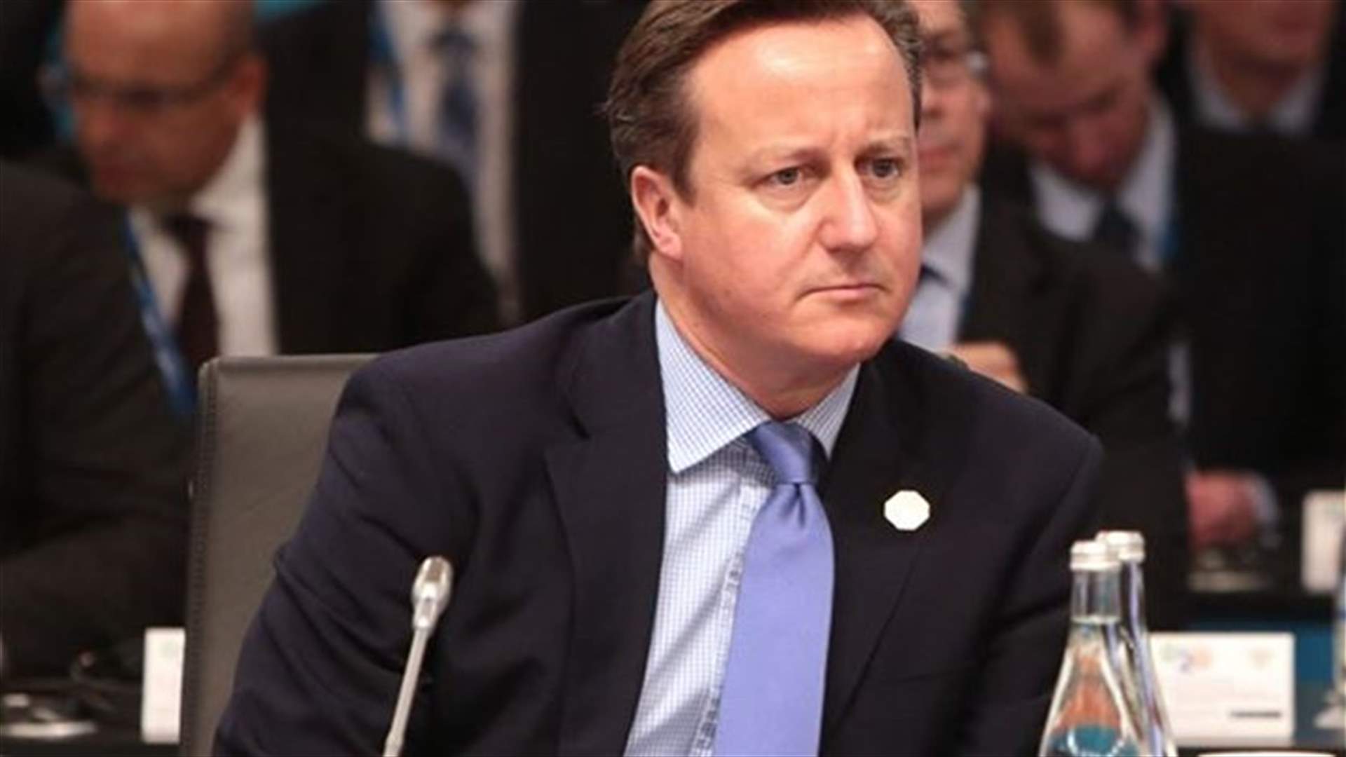 Britain's Cameron warns Russia of isolation, further sanctions over Ukraine