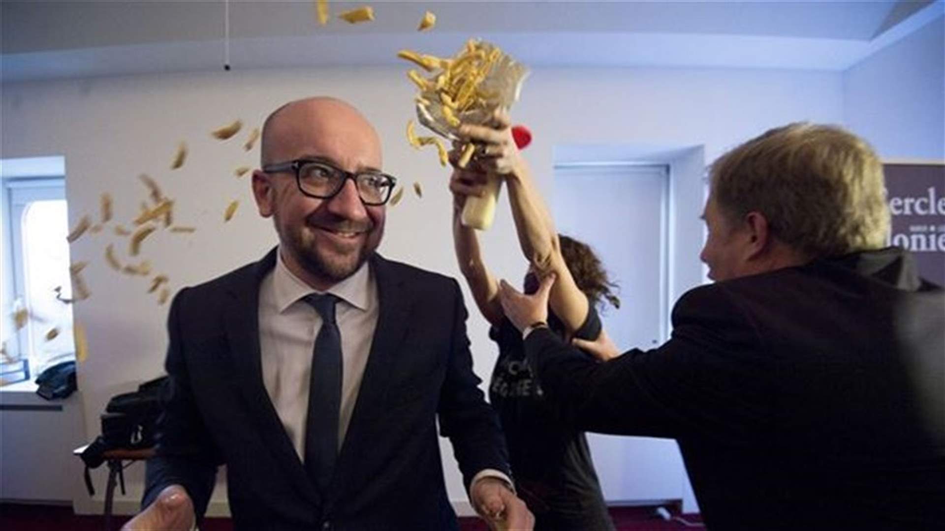 Belgian PM Showered With Fries And Mayo By Activists