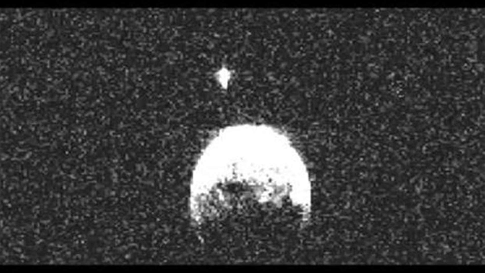 Giant asteroid buzzes past Earth