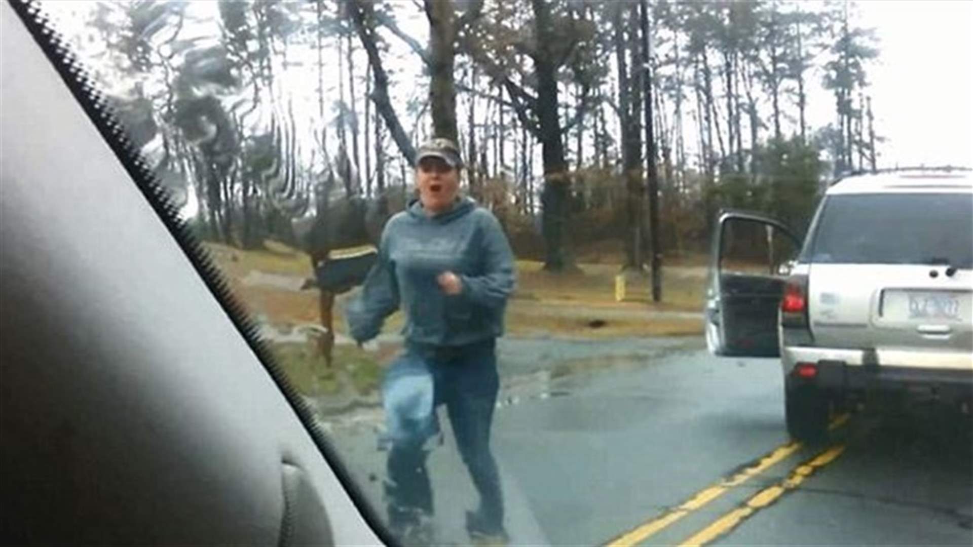 [VIDEO] Angry Woman Tries To Slam Car With Mother And Daughter On Board
