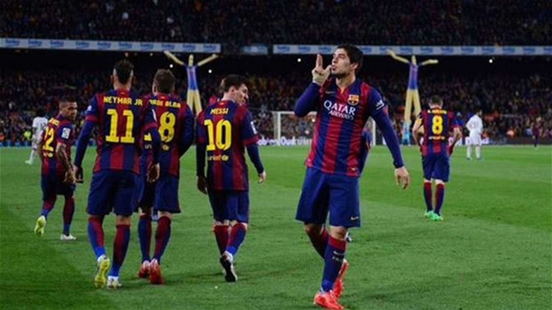 Suarez scores as Barca beats Madrid 2-1 to extend Liga lead