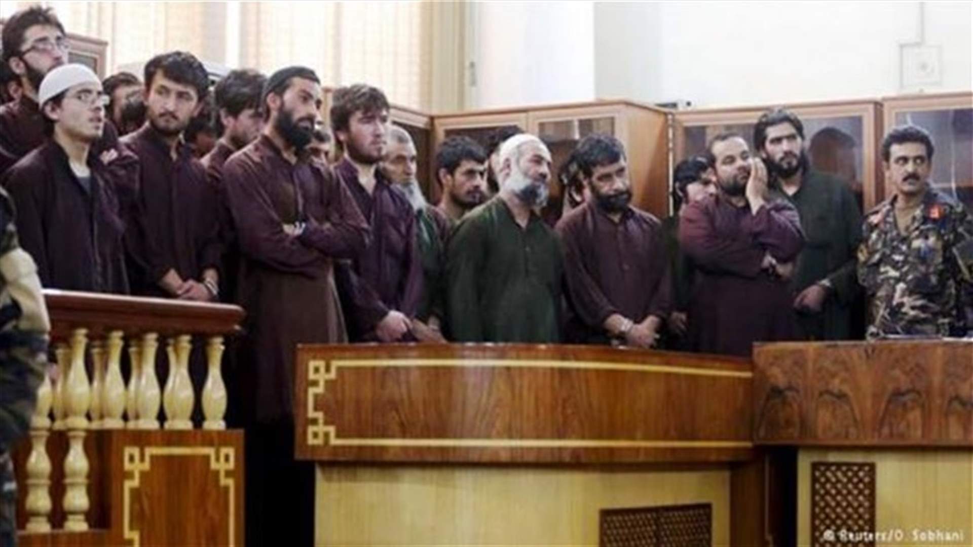 11 Afghan police get year in jail over mob killing of woman