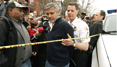 What did George Clooney and a handful of U.S. politicians do to get arrested?