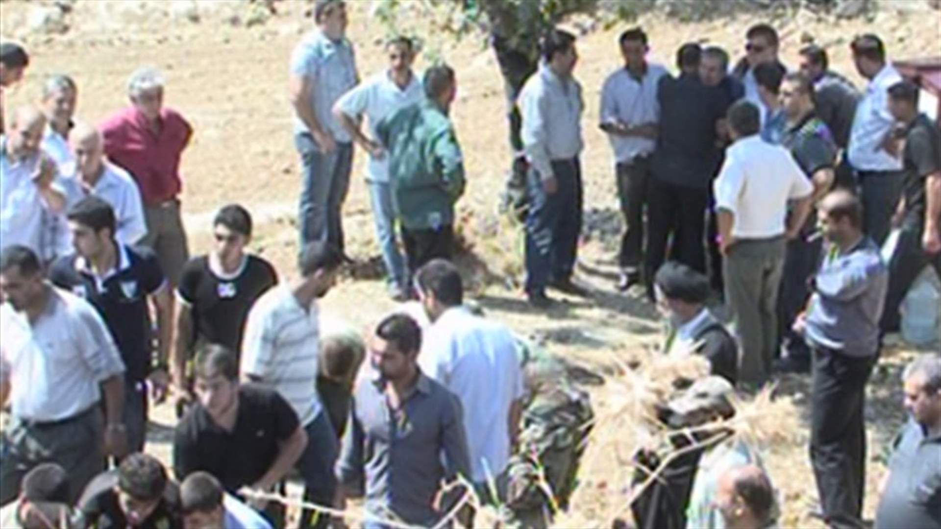 Massacre village embraces grief-stricken father