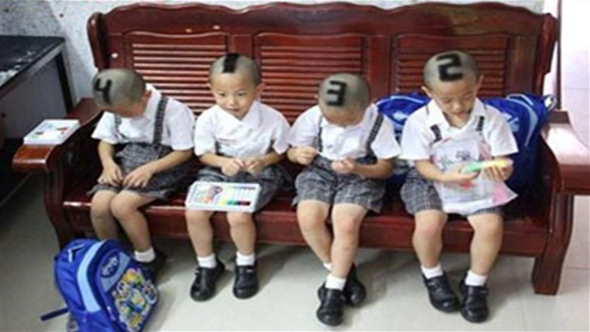 Chinese mom numbers her sons head