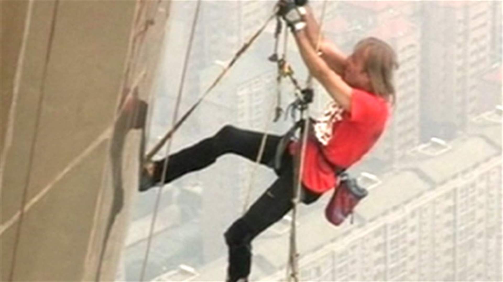   French "Spiderman" climbs the highest metal tower in the world