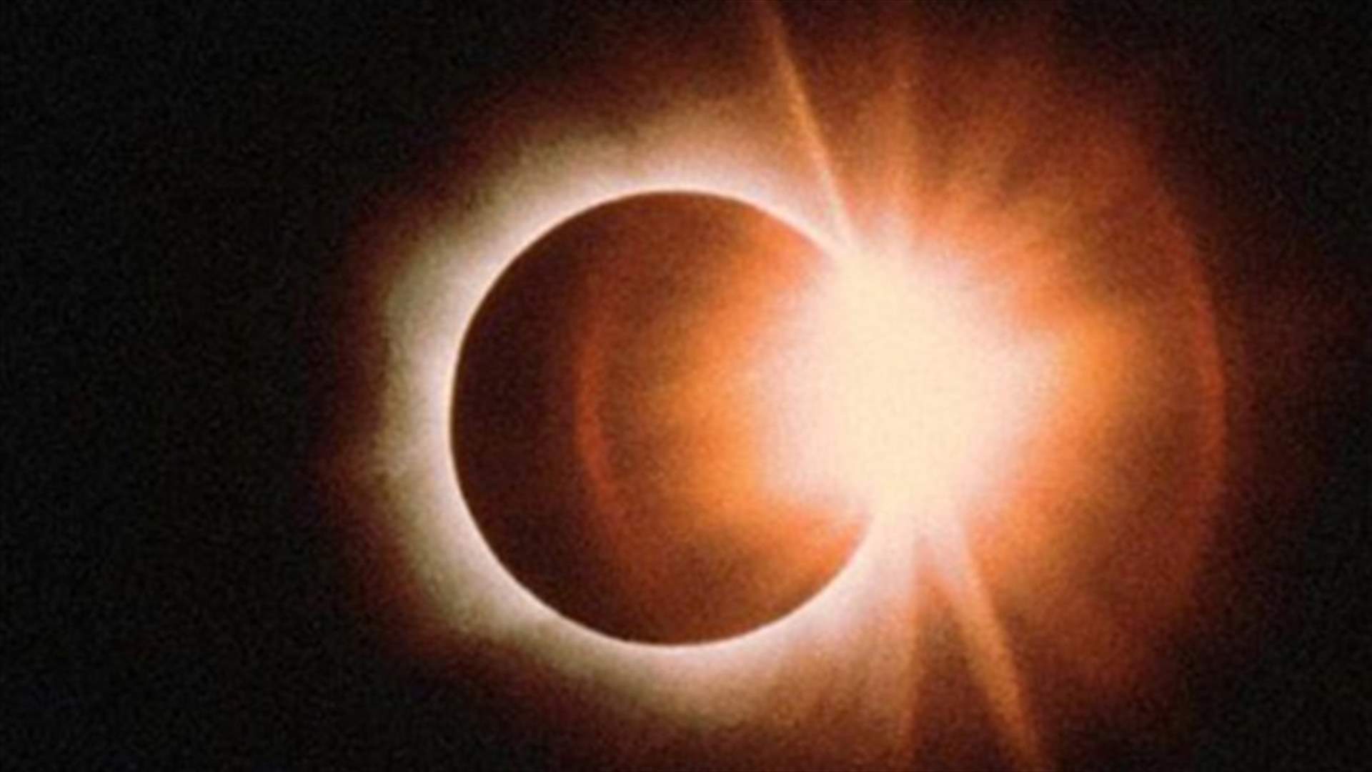 Clouds part as rare solar eclipse darkens north Australia 