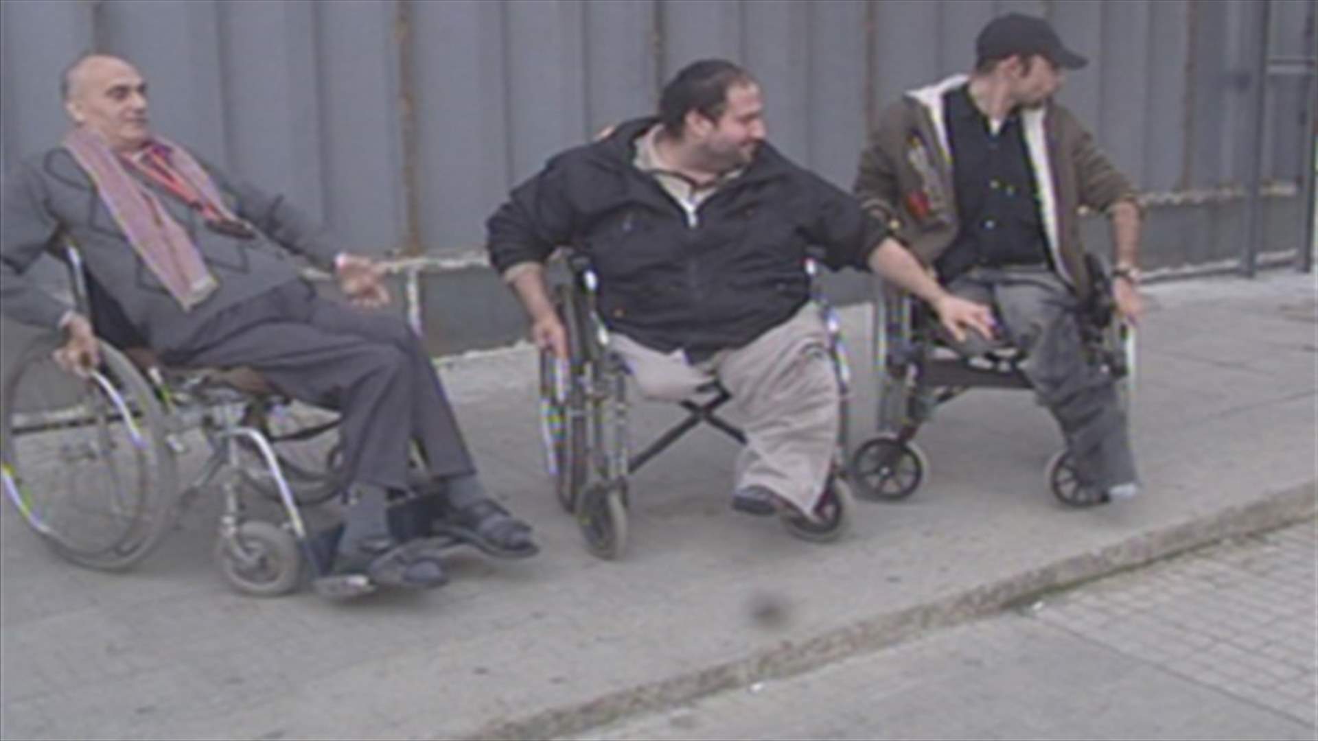 REPORT: Physically challenged people demonstrate outside HQ
