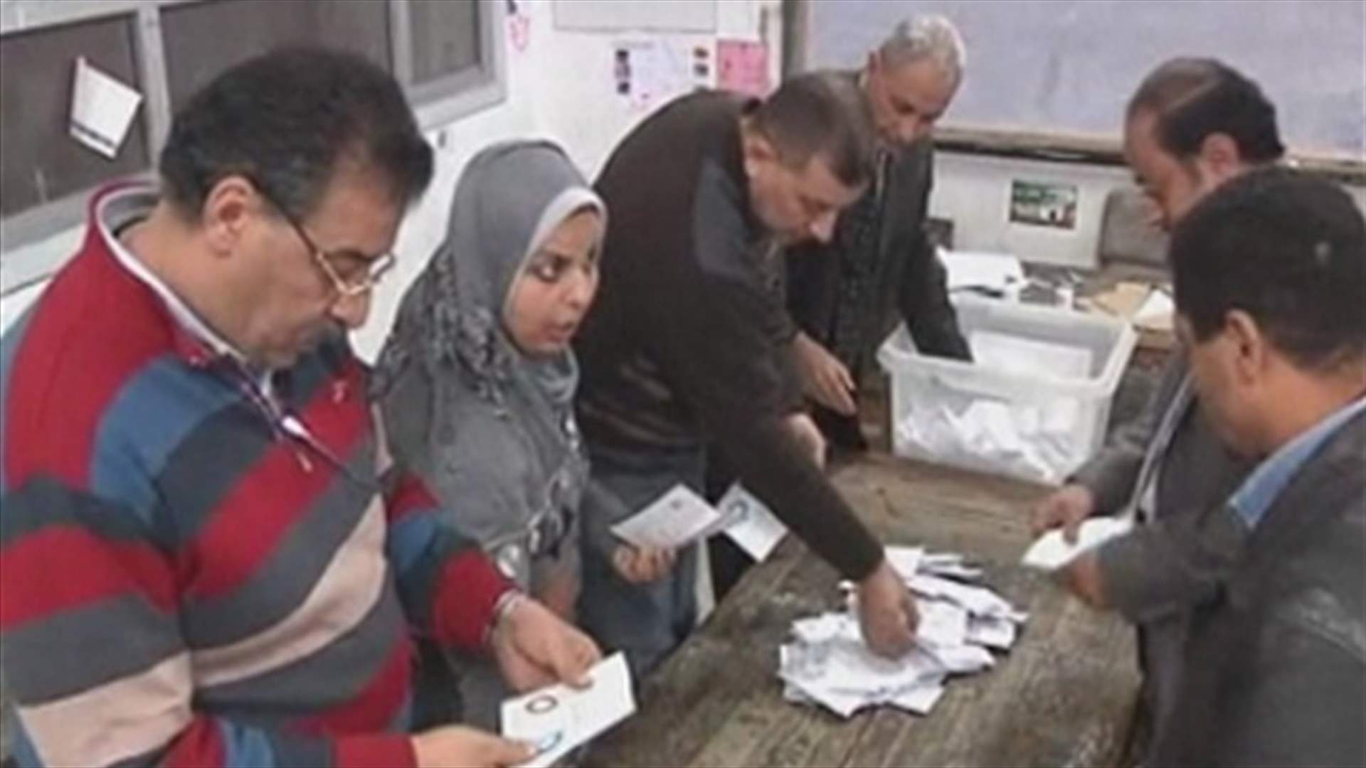 Egyptians narrowly back Islamist-shaped constitution, say rival camps