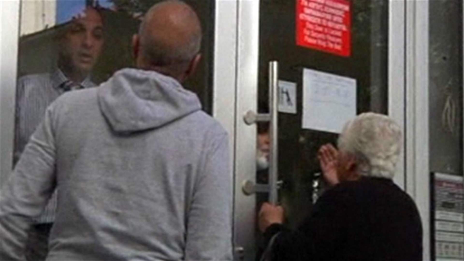 Cyprus banks reopen, under tight controls