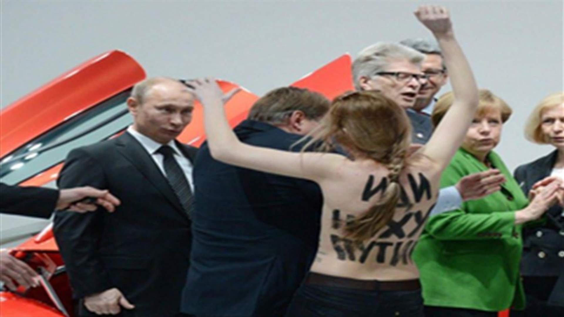 Kremlin urges Germany to punish topless protest against Putin