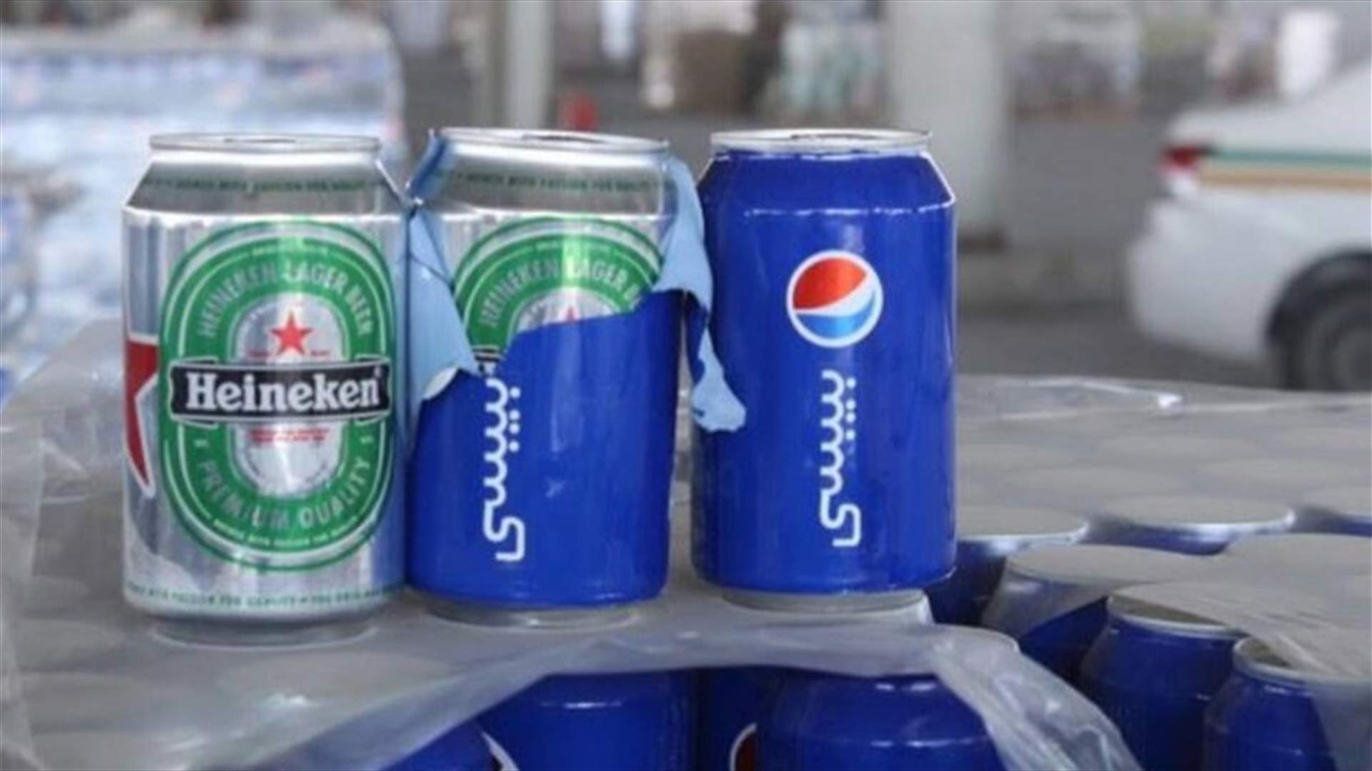 بالصور- البيرة في عبوات مشروبات غازية الى السعودية