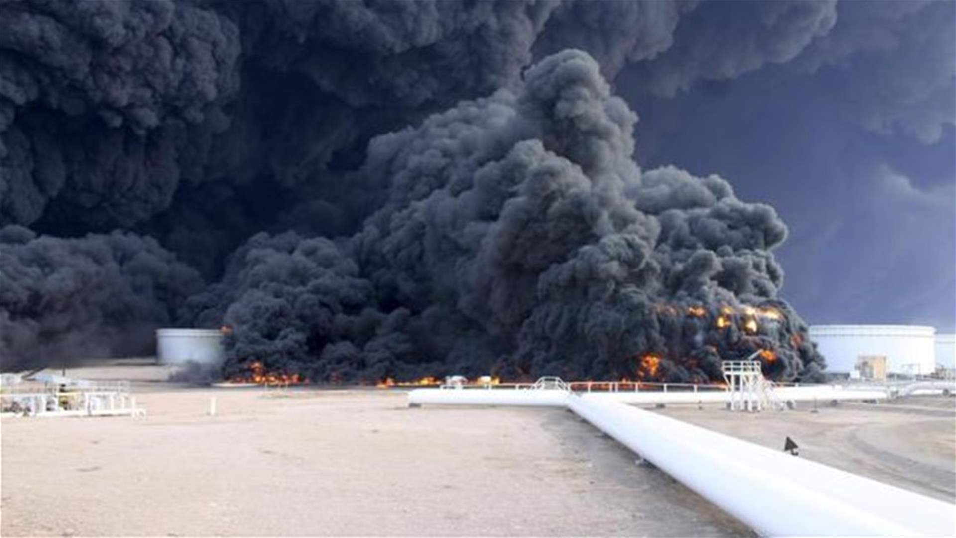 Four oil tanks now on fire at Libyan ports after clashes
