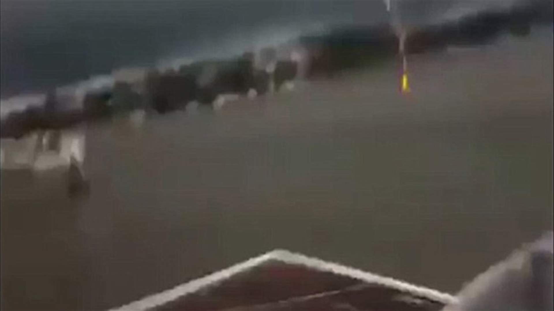 [VIDEO] Lightning Bolt Strikes Water Just Yards From Men