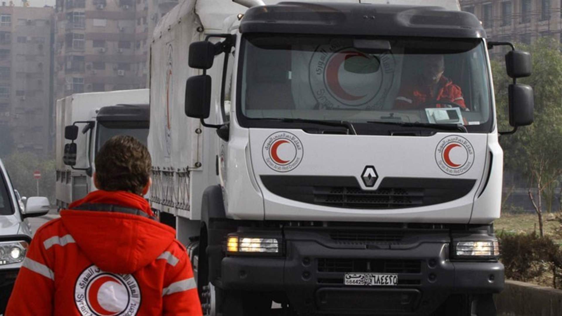 Syria aid trucks reach edge of besieged Damascus suburb